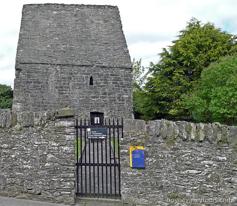 St Colmcille's House in Kells, a stone-roofed oratory behind a gate and dry-stone wall.