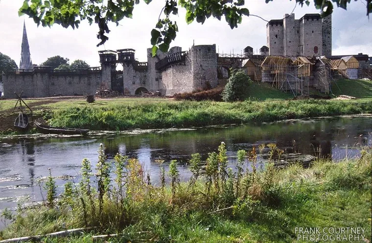 Trim Castle on the River Boyne during filming for Braveheart, with timber set buildings beside the keep.